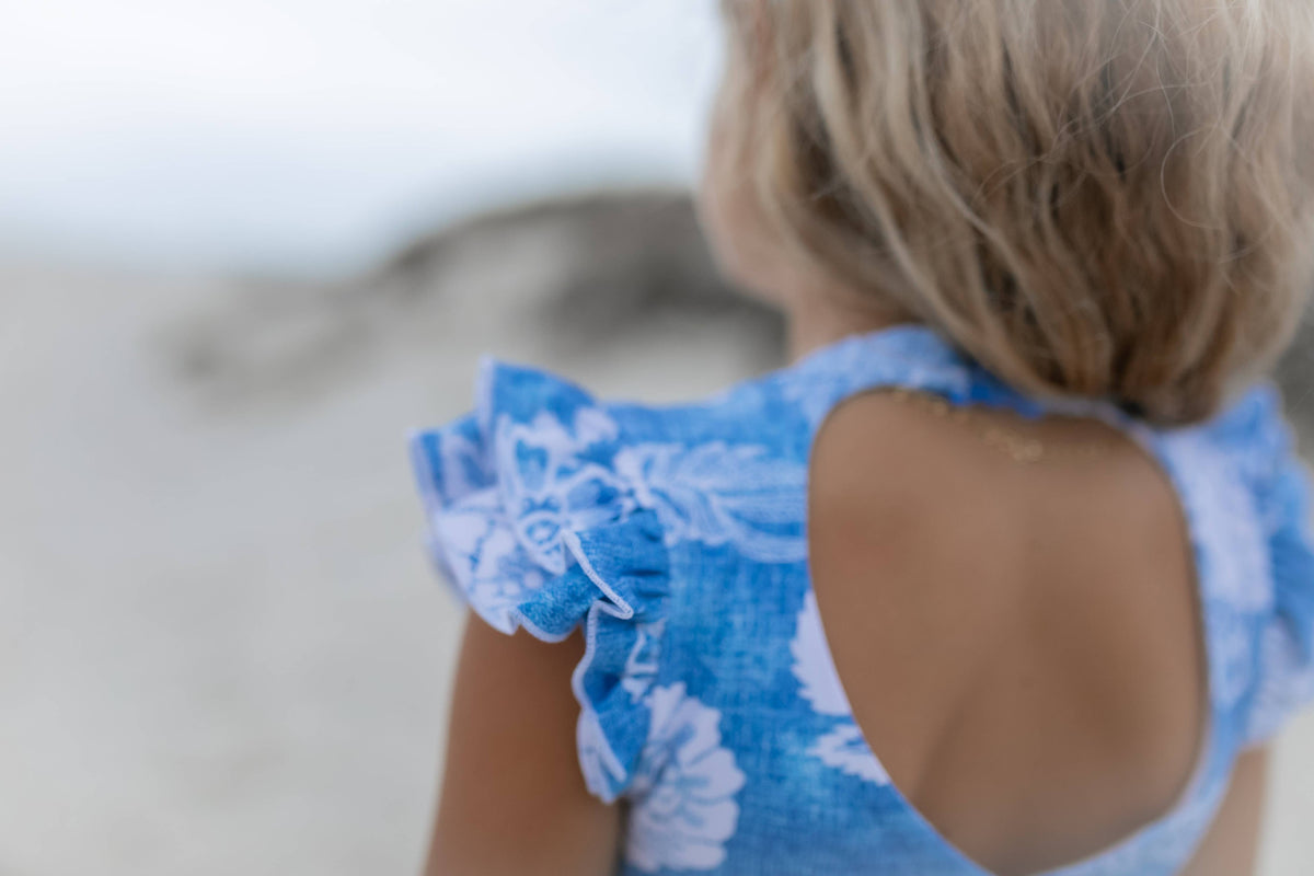 Oopsie Daisy | Blue Floral Open Back One Piece Ruffle Swimsuit