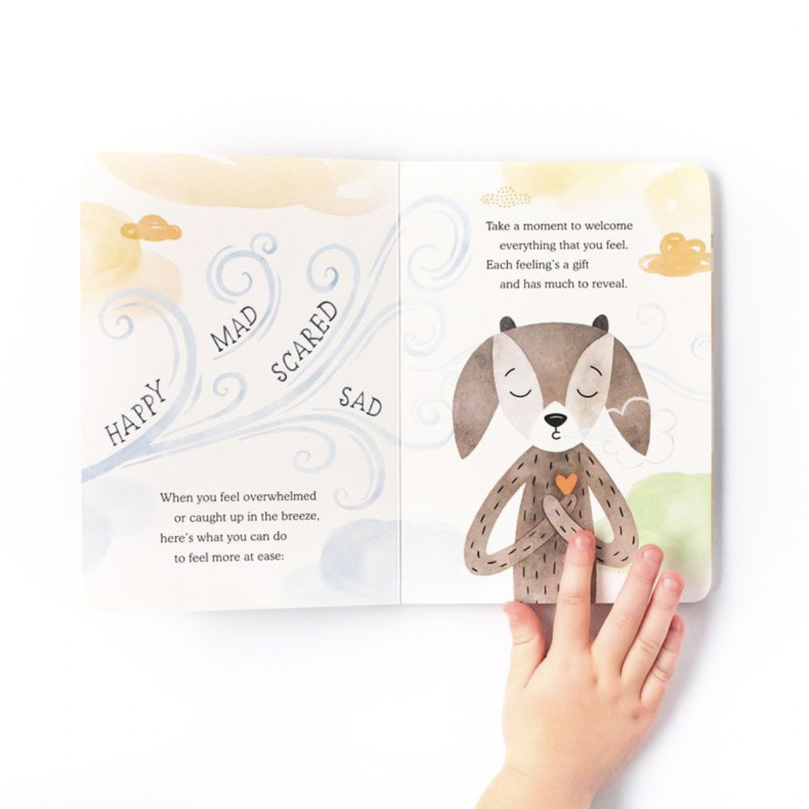 slumberkins ibex feels deeply board book held open with childs hand